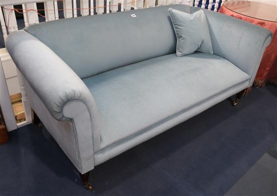 A pair of Georgian style mahogany settees covered in blue plush, W.195cm